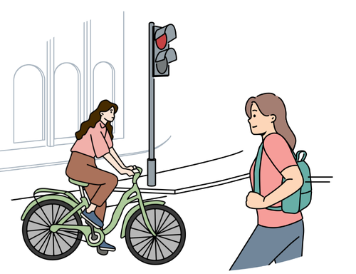 歩行者と自転車が赤信号のため横断歩道の手前で止まっている様子を描いたイラスト。